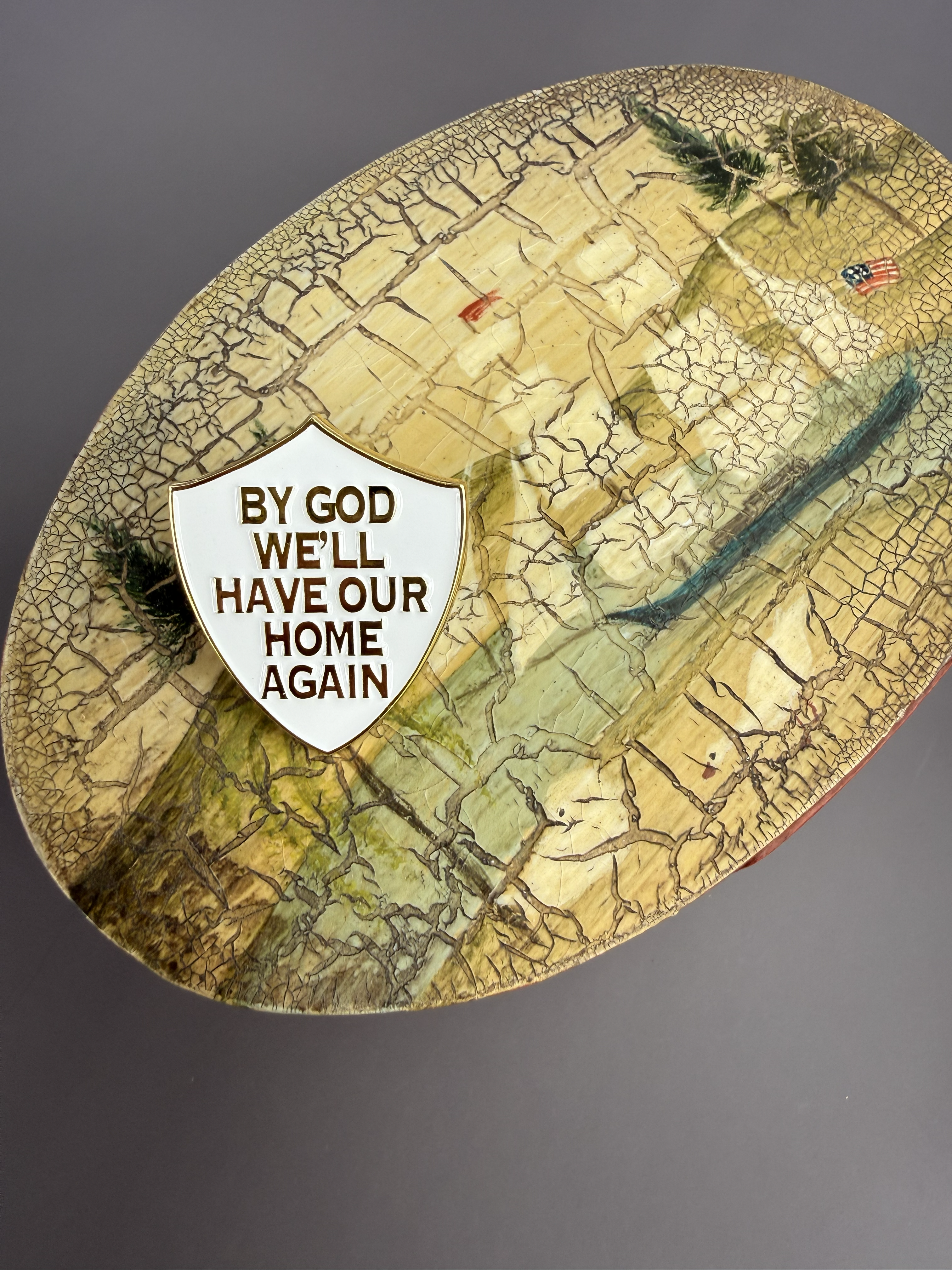 “By God We'll Have Our Home Again" Shield